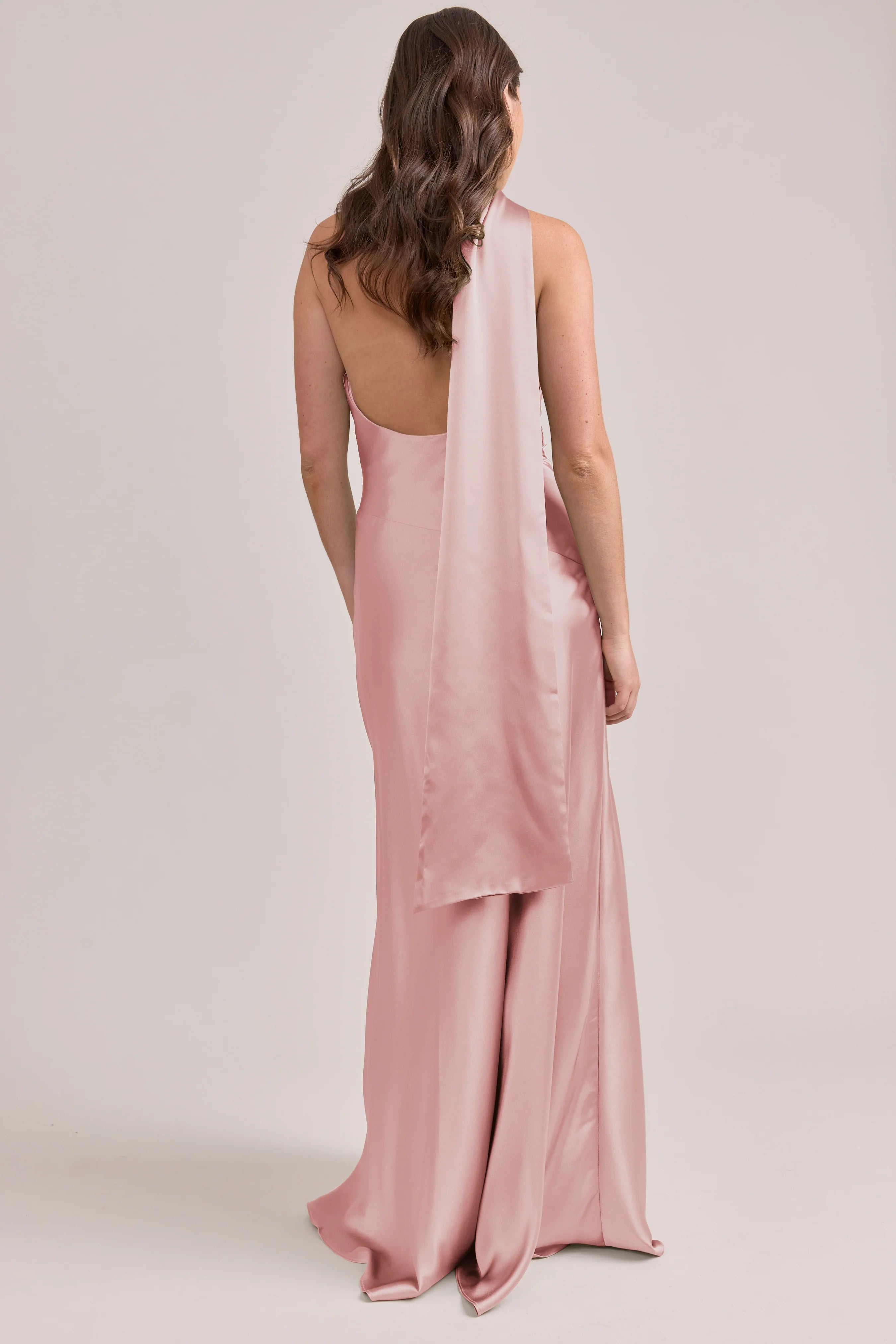 Blush Pink Halter One-shoulder Satin Bridesmaid Dresses with Ruched Waist and Flowing Back Sash