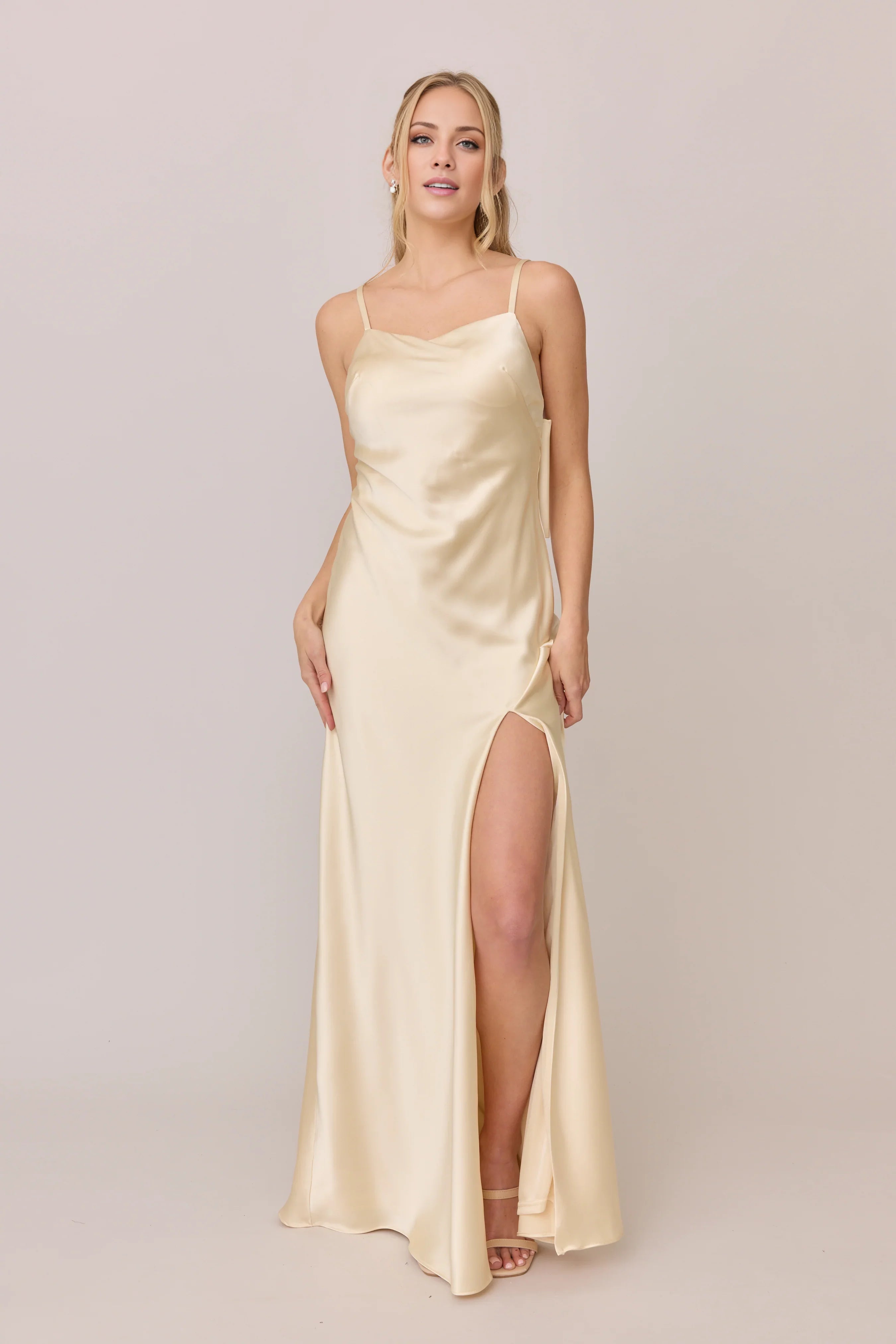 Elegant Champagne Satin Spaghetti-Strap Bow-Back Full-Length Bridesmaid Gown