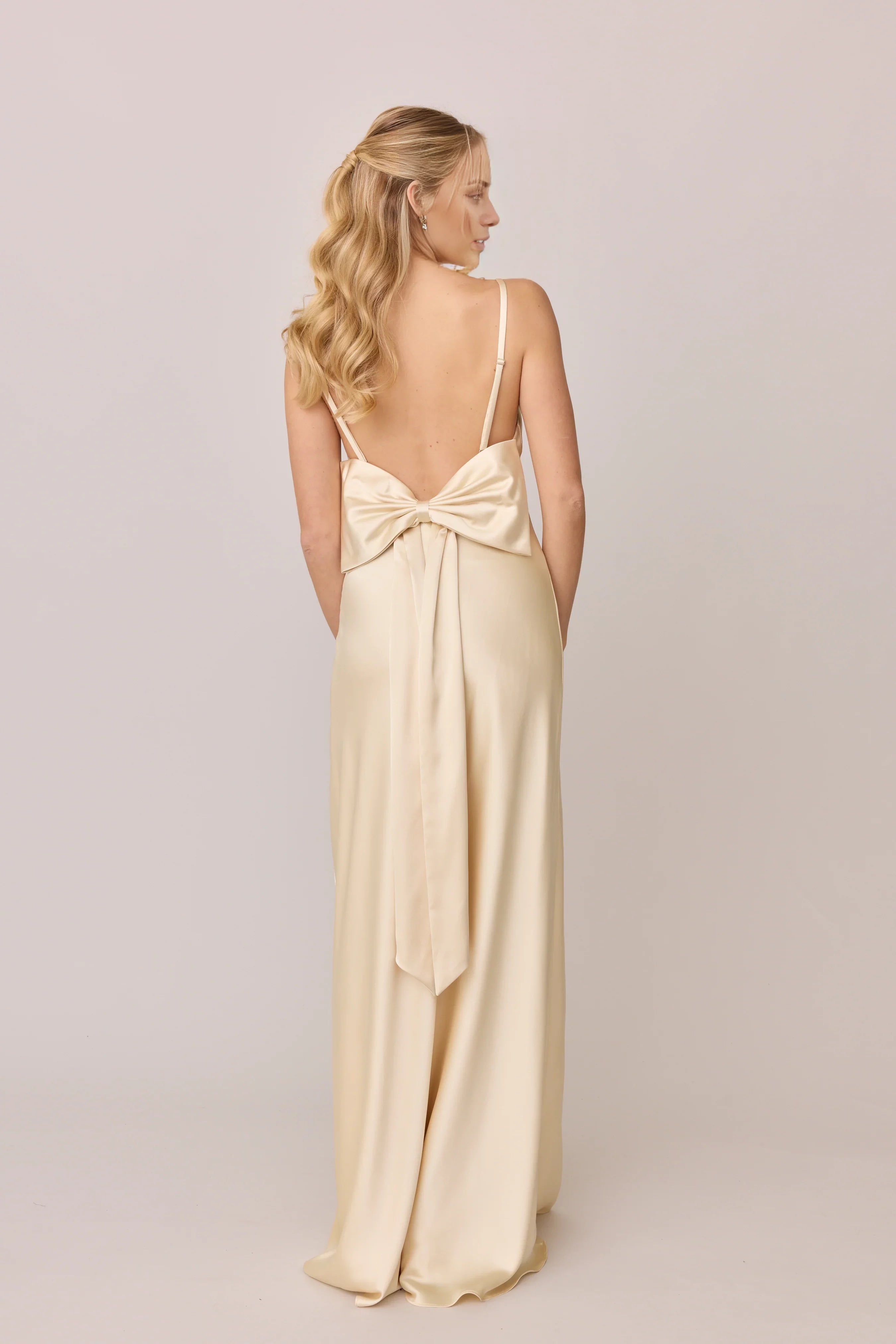 Elegant Champagne Satin Spaghetti-Strap Bow-Back Full-Length Bridesmaid Gown